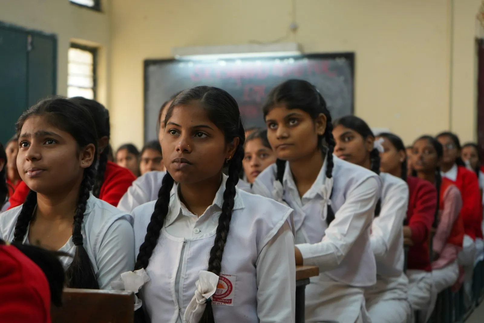 Students listening attentively in a school classroom